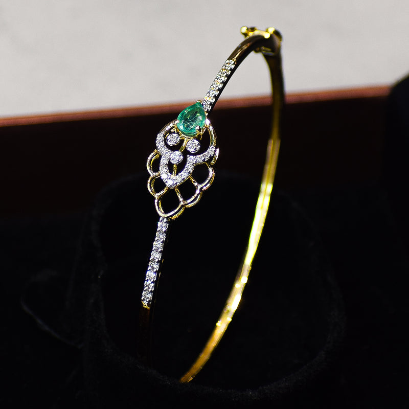 Floral pattern bracelet with green colored stone