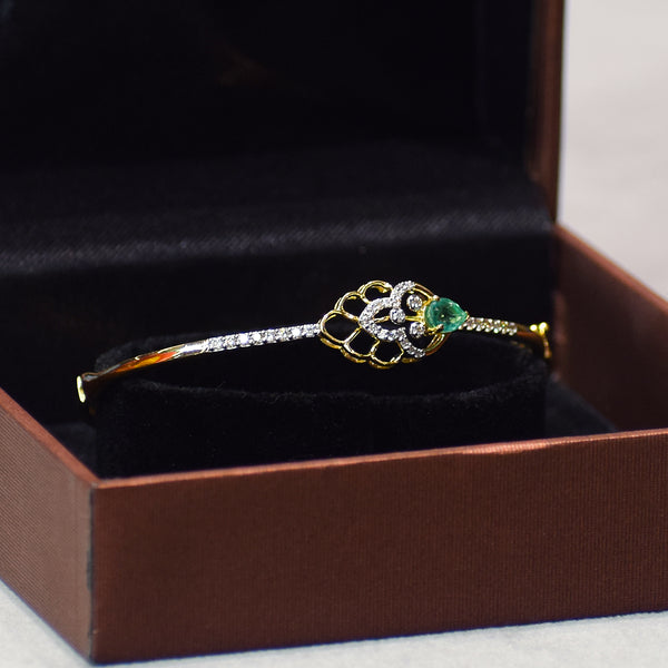 Floral pattern bracelet with green colored stone