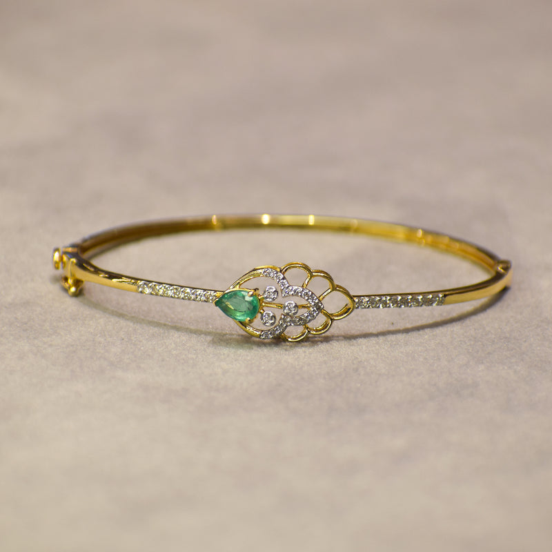 Floral pattern bracelet with green colored stone