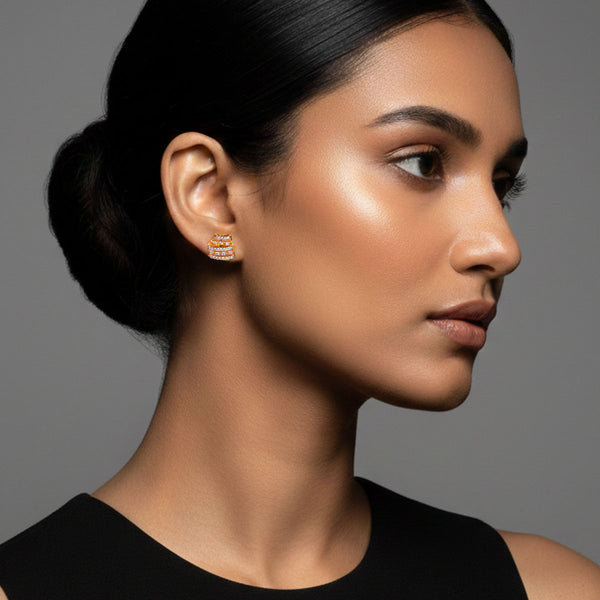 Pair of sleek dual bar gold stud earrings in yellow gold polish